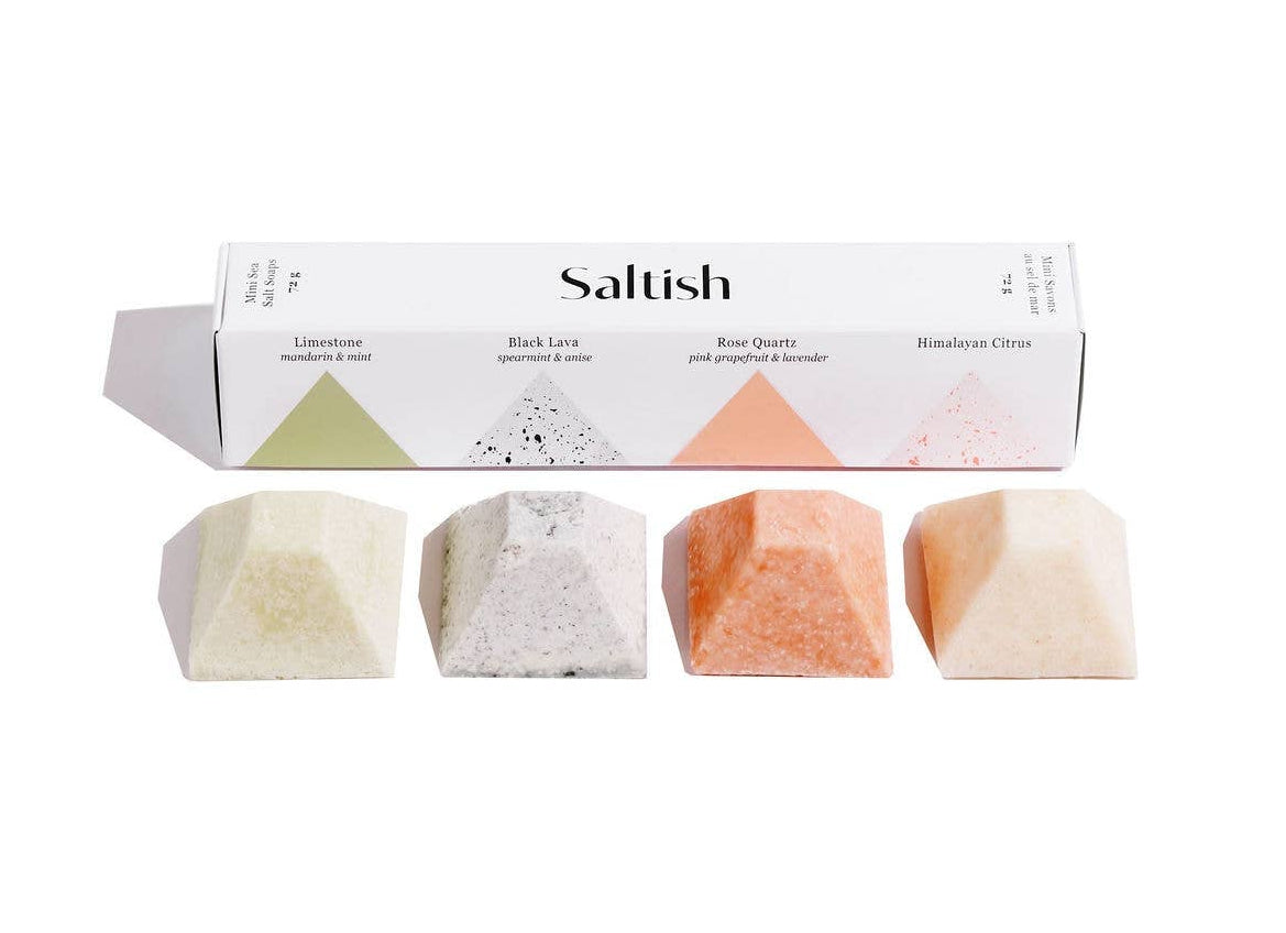 Set of four colorful soap bars with a 'Saltish' branded box on a white background